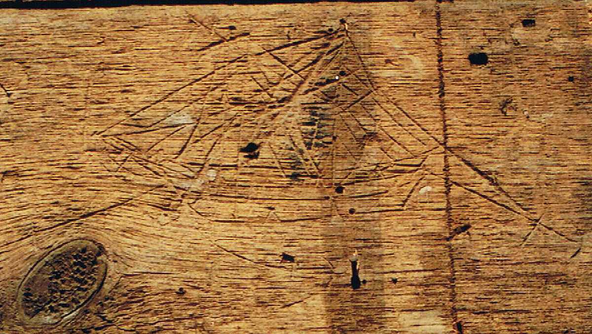 Carving of a ship on wall sheathing